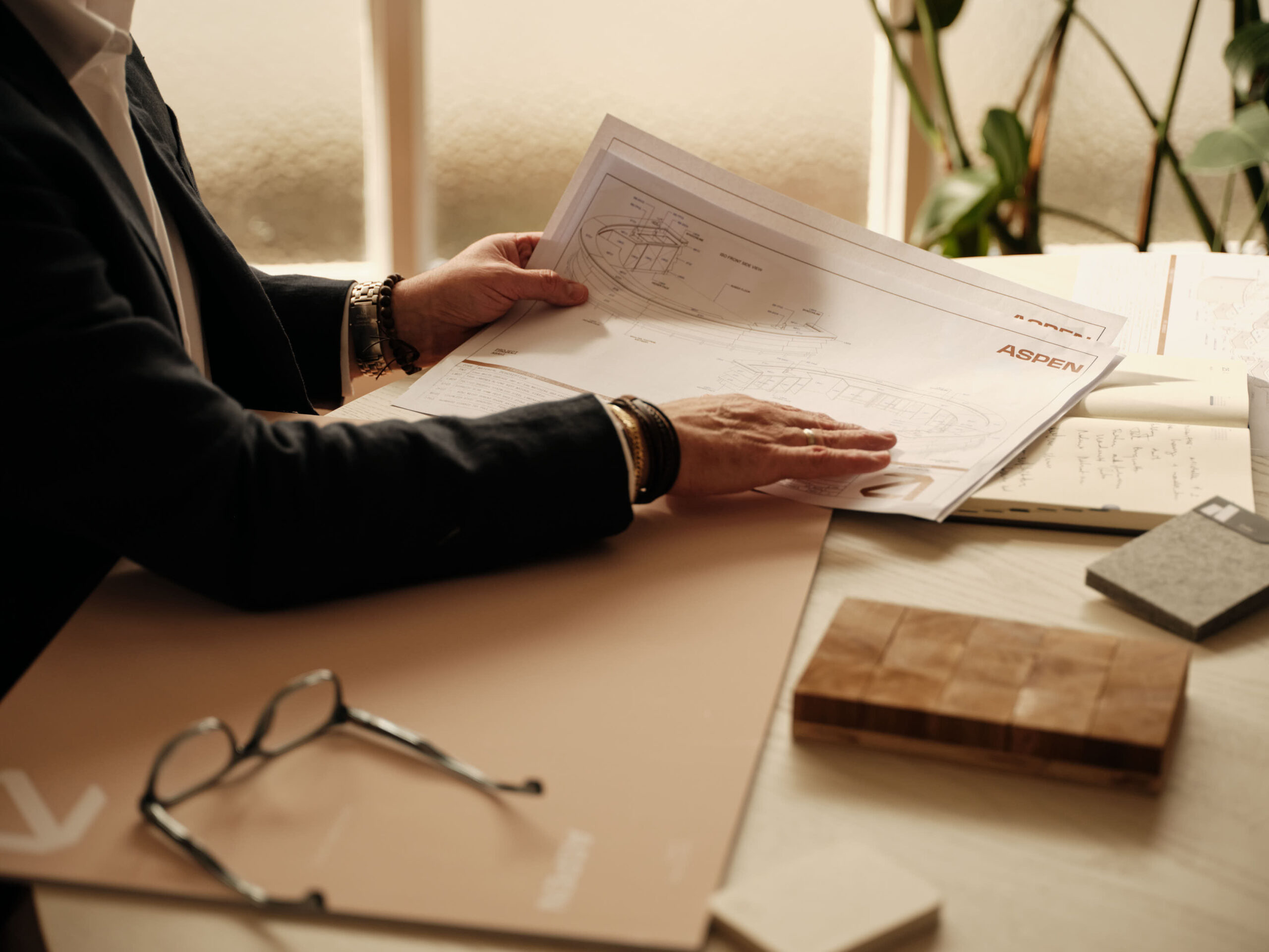 Close up of people looking at architectural plans